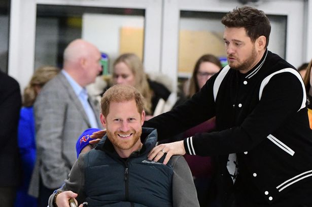 Prince Harry and Meghan Markle serenaded by Michael Buble after attempting wheelchair curling