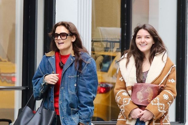 Katie Holmes’ lookalike daughter Suri, 17, almost towers over her during NYC stroll