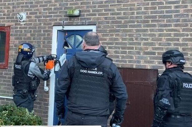 Police smash into home with CHAINSAW in early hours drugs raid that saw man arrested