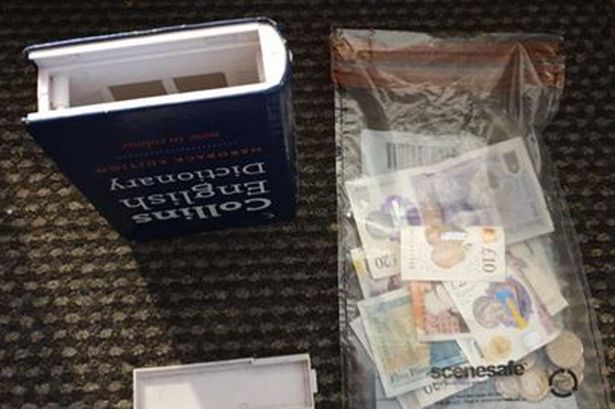 English dictionary packed with cash seized as police launch raids across Fylde Coast