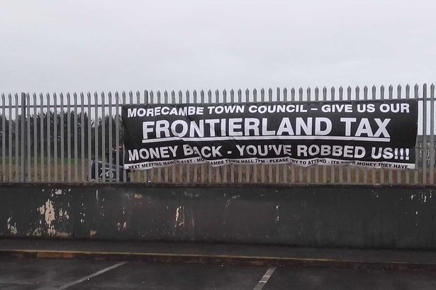 ‘You robbed us’: Huge banner appears blasting ‘stolen’ abandoned Frontierland theme park money