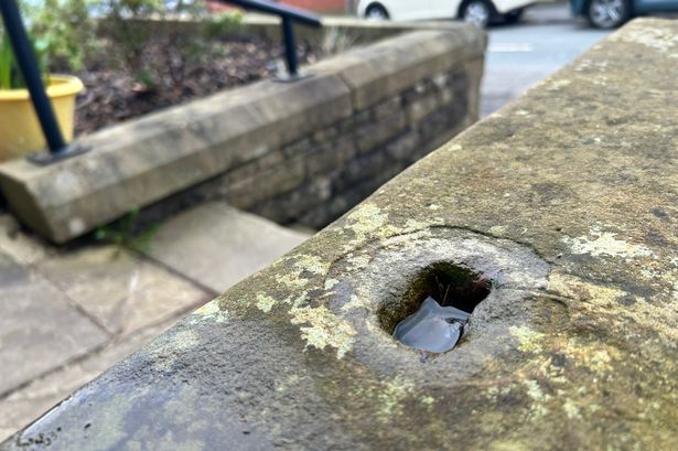 The reason stone borders of terraced houses in Lancashire have odd-looking holes