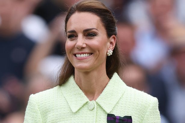 Smiling Kate Middleton carries her own bags in first video footage since surgery