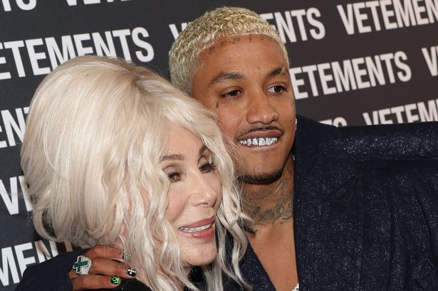 Cher shows off bleach blonde hair as she cosies up to boyfriend, 38, at Paris Fashion Week