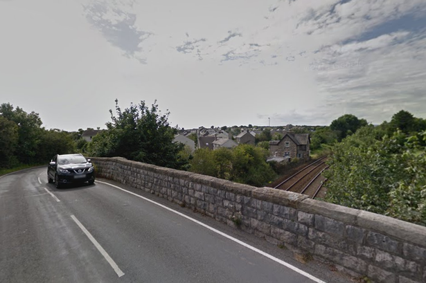 Woman, 33, arrested after man falls from bridge onto railway tracks