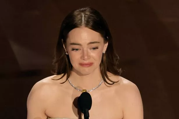 Emma Stone breaks down in tears as she suffers wardrobe malfunction amid Oscars win