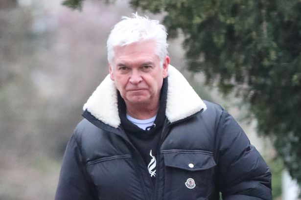 Phillip Schofield looks downcast walking new puppy as Cat and Ben take over on This Morning – 10 months after he quit over affair