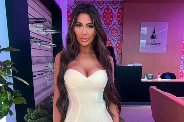 Chloe Ferry recovers in hospital after boob reduction as she shows off old implants