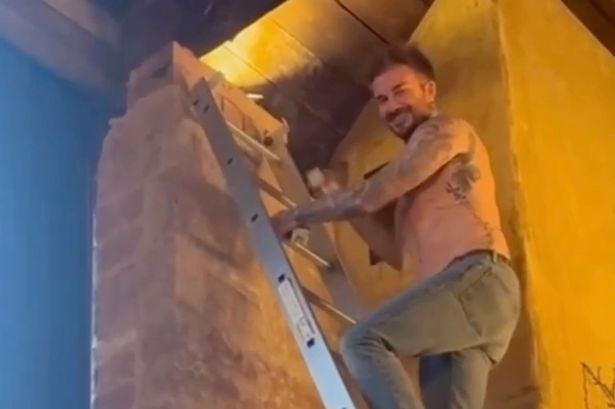 Victoria Beckham thrills fans with topless video of husband David completing some DIY