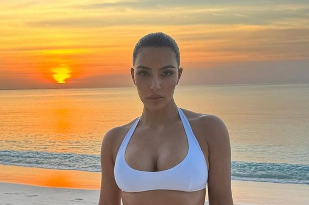 Inside Kim Kardashian’s tropical getaway as she stuns in bikini and spots dolphins during boat trip