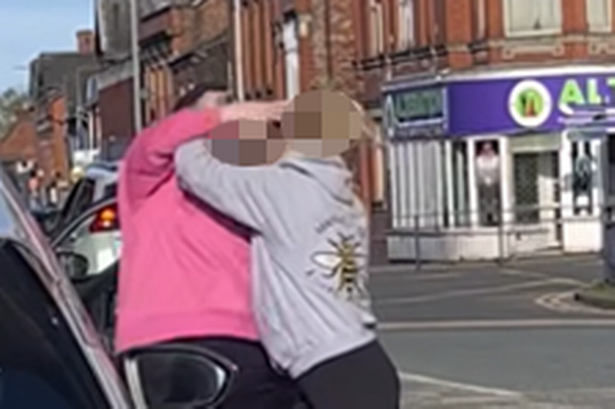 Mayhem as fight spills out between two women as they sit at traffic lights