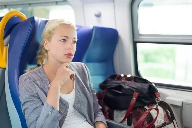 Woman refuses to move bag off train seat for stranger and people agree