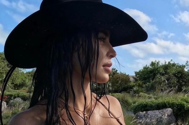 Kim Kardashian sends fans wild with sultry bikini and cowboy hat pics on holiday with sister Khloe