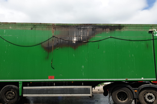 HGV driver manoeuvres lorry away from buildings as lithium battery bursts into flame