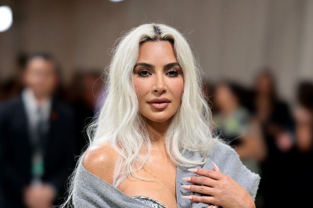 Kim Kardashian shocks with tiny waist in corset at Met Gala while others slam ‘grandad cardigan’