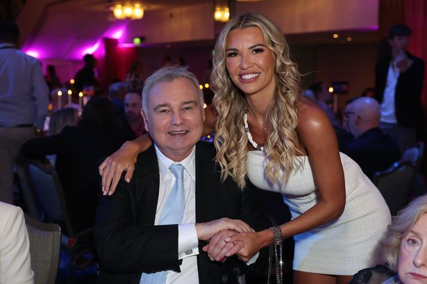 Smiling Eamonn Holmes seen in wheelchair after Ruth Langsford split as he poses with Christine McGuinness at Tric Awards