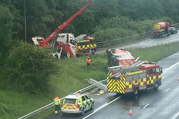 Four firefighters taken to hospital after fire engine overturns in M65 crash