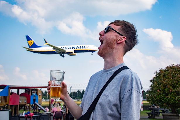 Drinkers lap up stunning view of planes coming into land over an airport pub