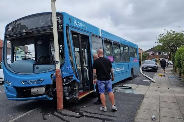 Dramatic pictures show aftermath after bus smashes into car and lamp posts