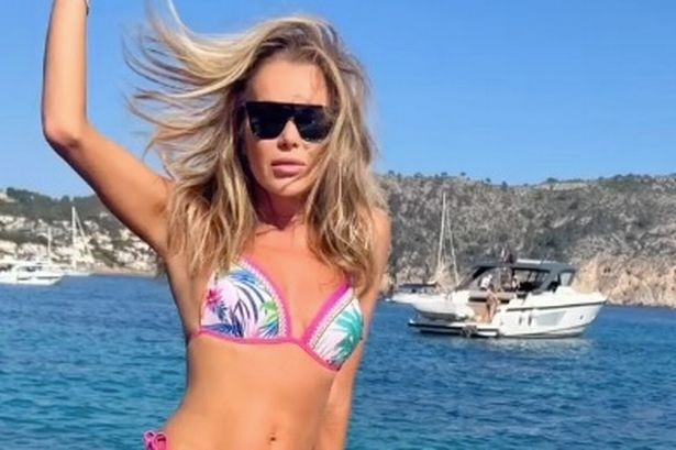 Amanda Holden, 53, branded ‘stunning’ by fans as she poses on yacht in tiny bikini