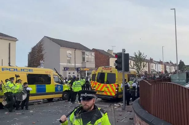 Violent clashes between protesters and police erupt in Southport