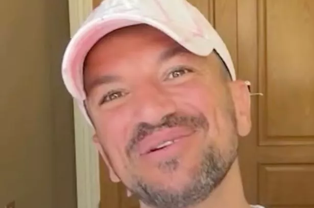 Peter Andre catches famous TV presenter sunbathing topless