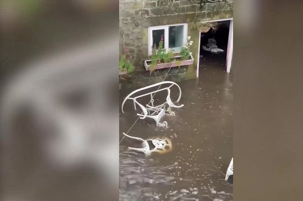 Terrifying moment water bursts into yard and reaches 2ft high in 7 minutes