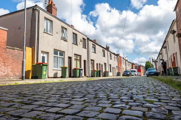 The bustling Lancashire neighbourhood where rubbish is piled high on street corners and sofas and mattresses are dumped in back alleys