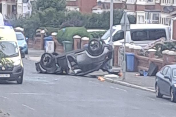 Scene of chaos after car flips on its roof during early hours crash