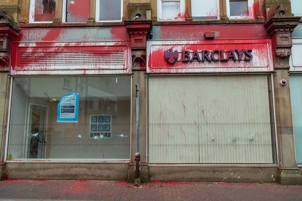 Burnley Barclays bank vandalised and covered in red paint by pro-Palestine activists