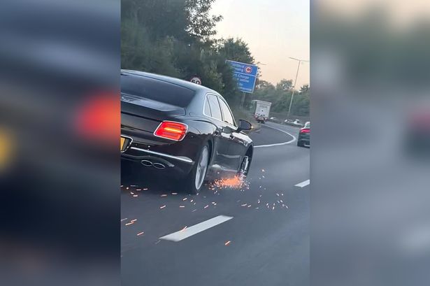 Sparks fly as £175k Bentley driven down motorway missing a tyre