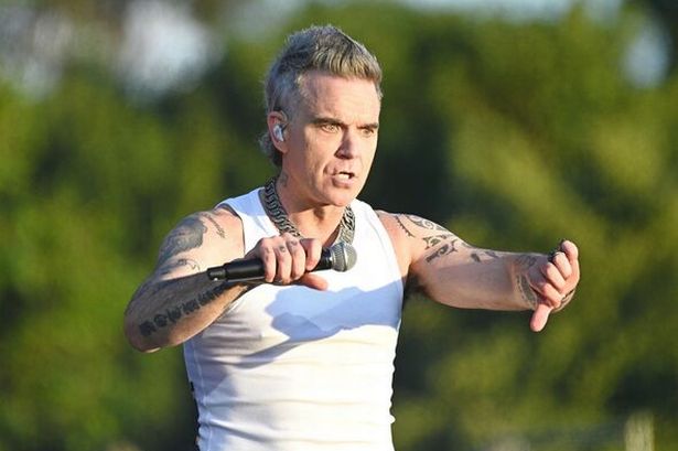 Robbie Williams leaves fans in tears after halting show with surprising move