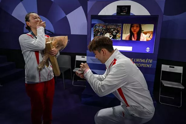 Olympian gets engaged in front of world’s media after medal ceremony in sweet City Of Love proposal