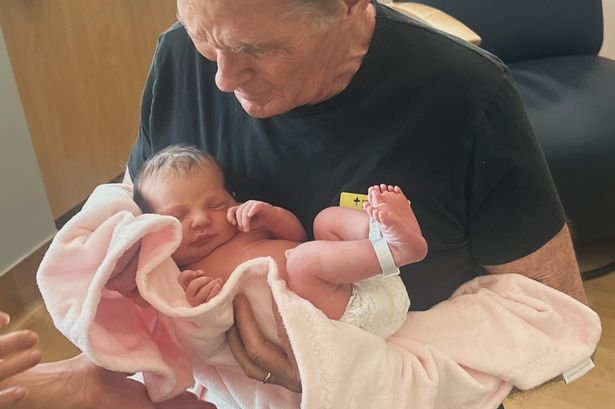 Baywatch legend David Hasselhoff proudly reveals he’s a grandad as he emotionally cradles newborn