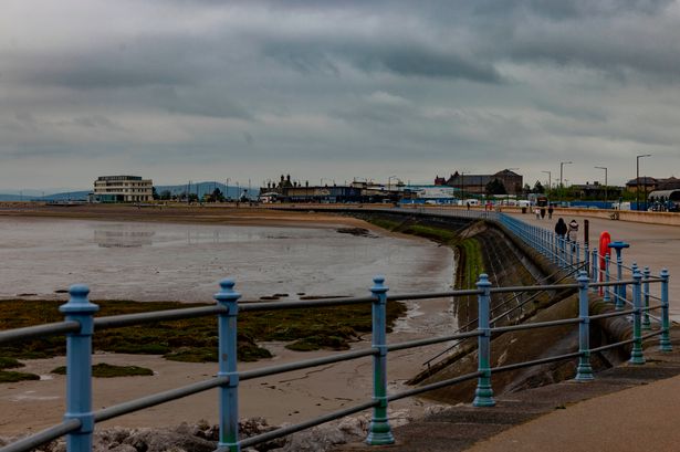 Yob arrested by cops after scratching racist symbols into FROST on seafront wall