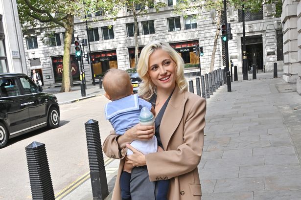 Multi-tasking mama Pixie Lott spotted feeding adorable baby Bertie outside London Fashion Week