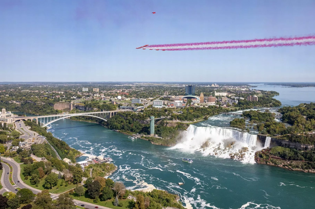 Stunning photos show Red Arrows performing flypast over iconic landmark