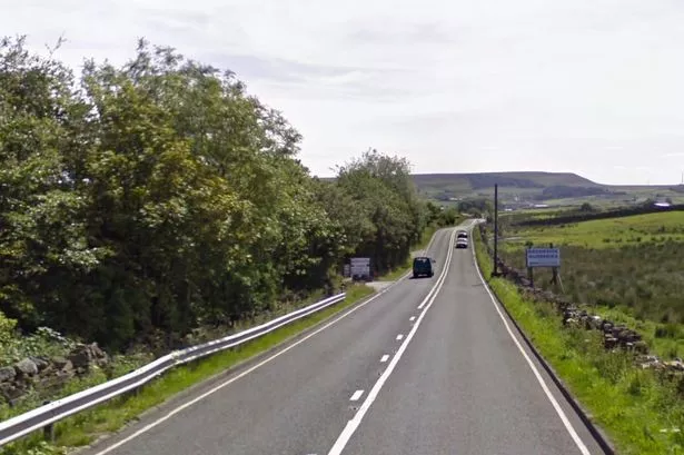 Van smashes into wall leaving major road shut and two injured