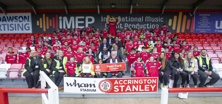 Football club hands out free replica shirts to children from 41 schools