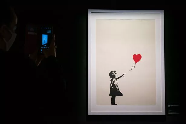 Two charged over theft of Banksy painting from London gallery