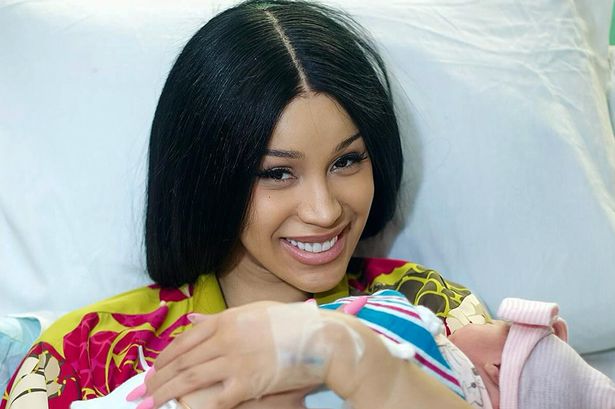 Cardi B welcomes third child as she cradles newborn in sweet hospital photos