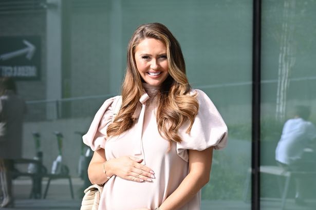 Charlotte Dawson proudly cradles her baby bump amid bombshell fiancé text scandal