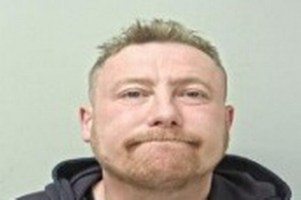 Smirking man wanted for breaching a restraining order as police issue plea