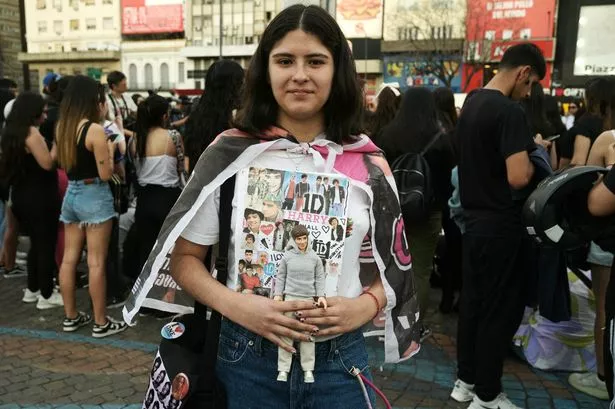 Tributes laid to Liam Payne as fans gather outside Buenos Aires hotel where star, 31, died