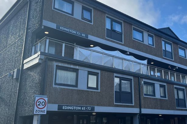 Murder probe launched as screen erected on balcony at block of flats