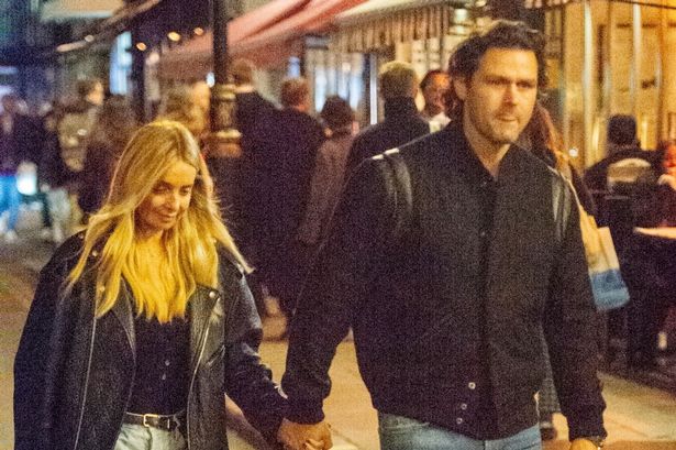 Louise Redknapp loved-up as she walks hand-in-hand with hunky younger man Drew