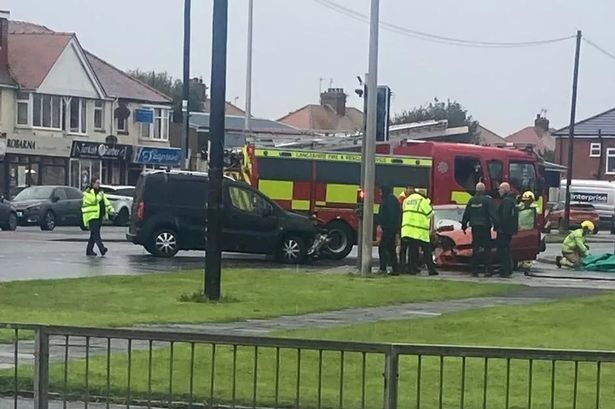 Elderly man rushed to hospital after crash between car and van on busy road