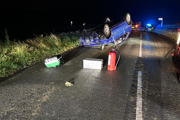 Lancashire weather chaos as car and tractor overturn, motorists stuck in floodwater and roads shut