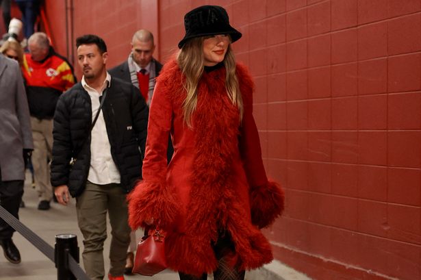 Taylor Swift wraps up in furry red coat to support Travis Kelce after major celebration