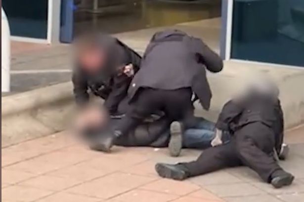 Police filmed at Manchester Airport ‘kicking and punching’ arrested man as he is pinned to the ground